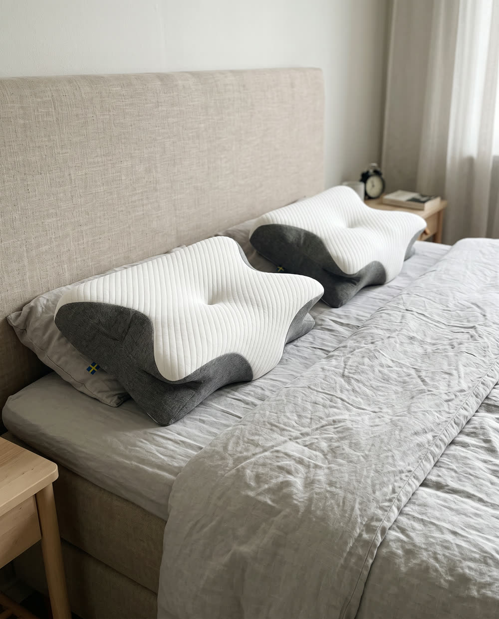 Two SleepEase sleeping pillows on a double bed